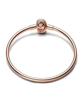 Pandora - Set in 14k Rose gold-plated & Sterling Silver bangle with encircled clasp and clear cubic zirconia